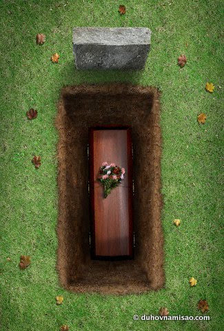 Coffin in Open Grave --- Image by © Daniel Smith/Corbis